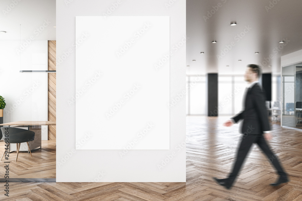 Businessman in modern office with billboard Businessman in modern office with billboard