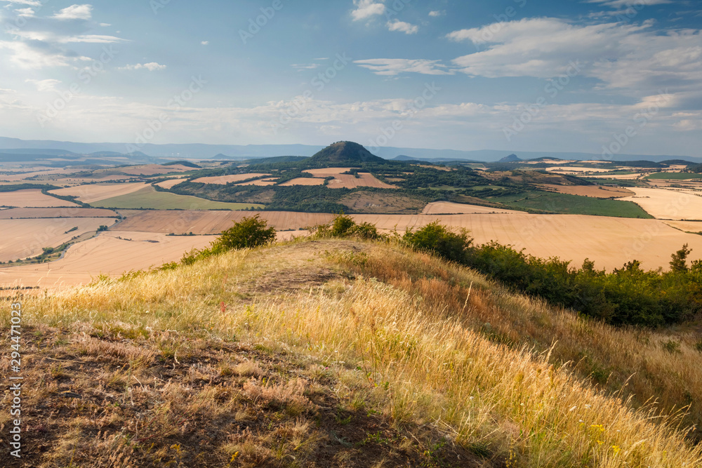 Beautiful summer sunset on the view point above the deep valley in Ceske stredohori mountains, Czechia