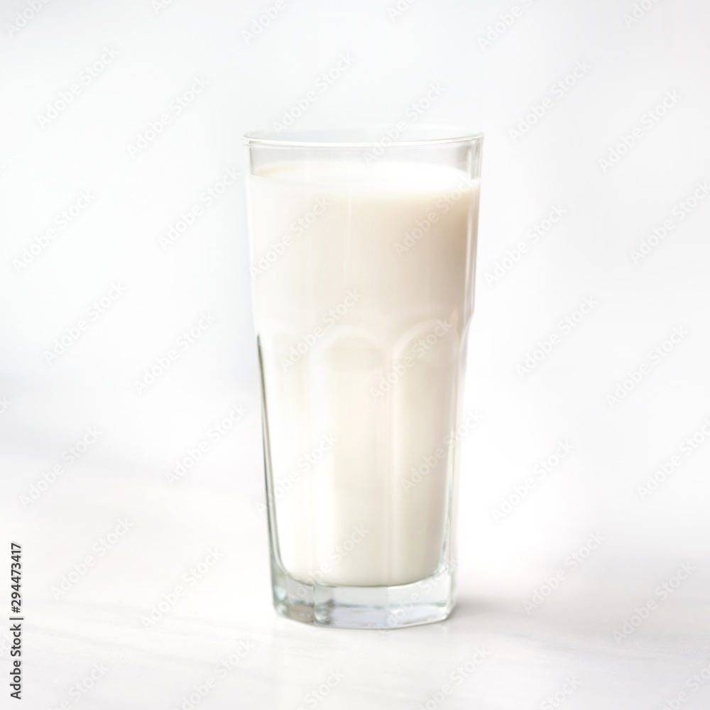 Glass of milk on a white marble table Glass of milk on a white marble table