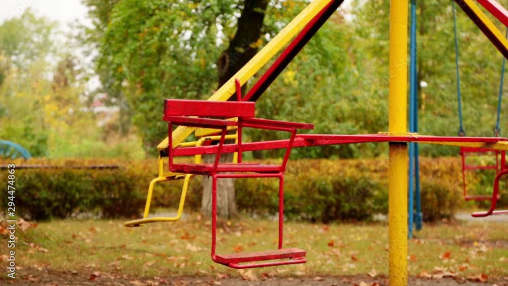 motion of an empty children's carousel. the carousel moves at low speed counterclockwise, stops and starts to move clockwise. autumn. full hd, no sound. motion of an empty children's carousel. the carousel moves at low speed counterclockwise, stops and starts to move clockwise. autumn. full hd, no sound.