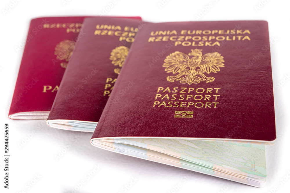 Polish passport on a white table. Identification document needed in a foreign country. Polish passport on a white table. Identification document needed in a foreign country.