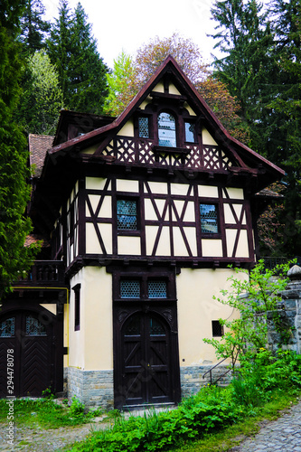Sinaia, Romania, May 15, 2019: View of an old house in a dark wet forest. © Dzmitry