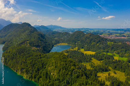 Aerial view on Alpsee lake  Bavaria  Germany. Concept of traveling and hiking in German Alps.