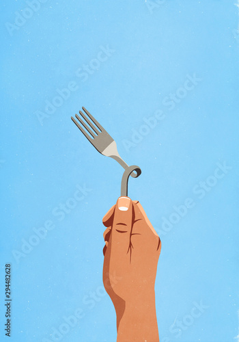 Hand holding twisted fork photo