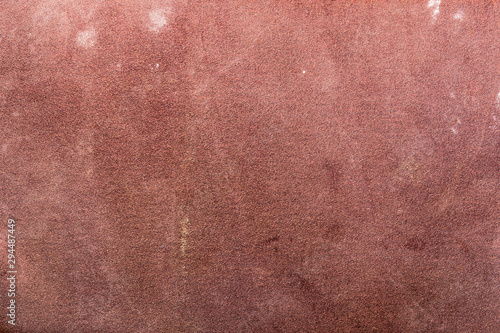 worn texture of sandpaper, close-up abstract background