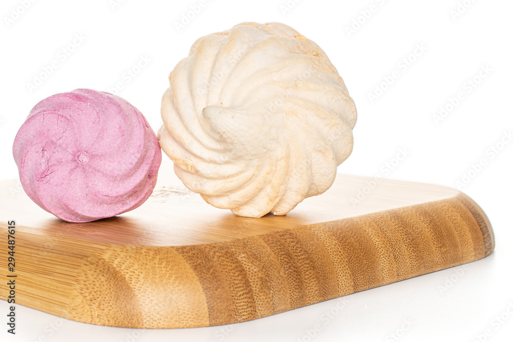 Group of two whole fresh pastel zefir on wooden square plate isolated on white background Group of two whole fresh pastel zefir on wooden square plate isolated on white background