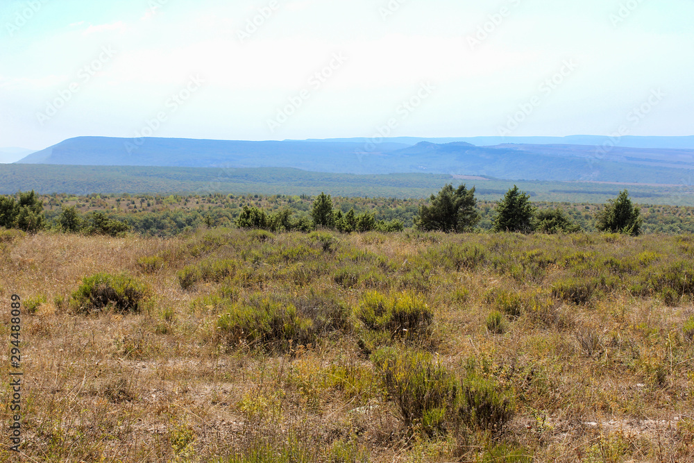 Mountain range in the haze on the horizon. Mountain range in the haze on the horizon.