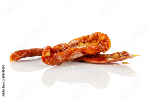 Group of three slices of dry red cherry tomato isolated on white background