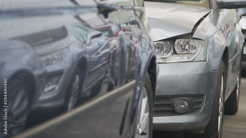 Detail Of Car With Bodywork Panels Damaged In Motor Vehicle Accident Parked In Garage Repair Shop Detail Of Car With Bodywork Panels Damaged In Motor Vehicle Accident Parked In Garage Repair Shop