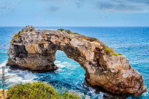 Beautiful natural rock arch at viewpoint, Mirador Es Pontas, island of Mallorca, Balearic islands, Spain