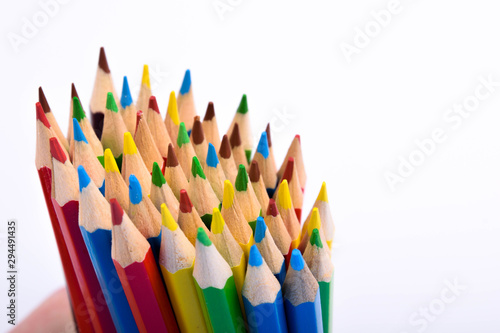 Colored pencils background.Color pencils on blue background.Close up. Many different colored pencils on blue background.Colorful pencil .Colorfull