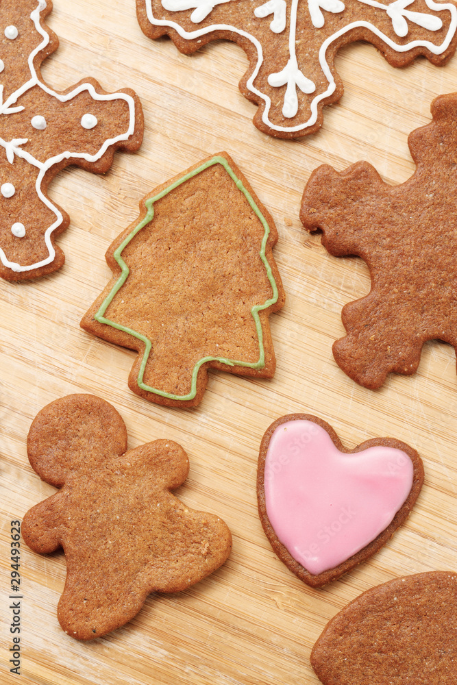 Christmas gingerbread cookies background. Gingerbread man, Christmas tree and snowflakes shaped cookies Christmas gingerbread cookies background. Gingerbread man, Christmas tree and snowflakes shaped cookies