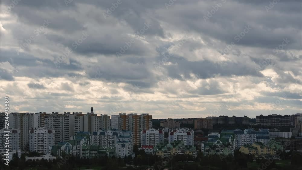 Gray Clouds moving in the Sky above the residential area. Time Lapse. Gray Clouds moving in the Sky above the residential area. Time Lapse.