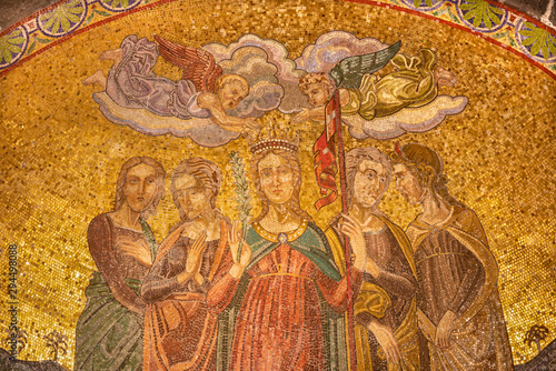 BELAGGIO, ITALY - MAY 10, 2015: The mosaic of St. Ursula and other women martyrs in church Chiesa di San Giacomo by Castemari di Venezia from beginn of 19. cent.