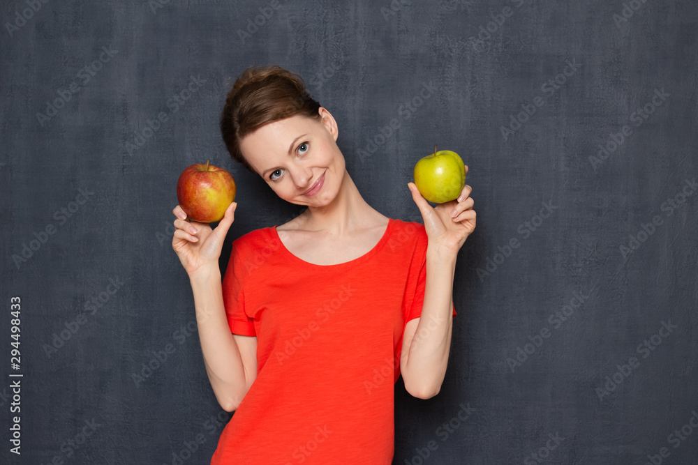 Portrait of happy girl holding ripe apples in hands Portrait of happy girl holding ripe apples in hands