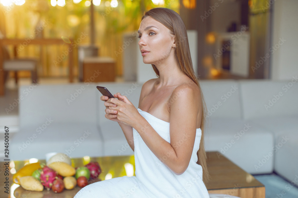 Young beautiful girl with a smartphone