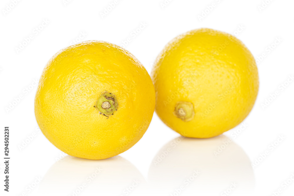 Group of two whole fresh yellow lemon isolated on white background Group of two whole fresh yellow lemon isolated on white background