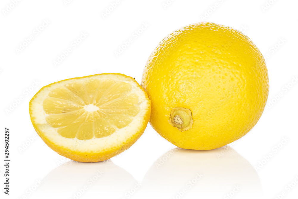 Group of one whole one half of fresh yellow lemon isolated on white background