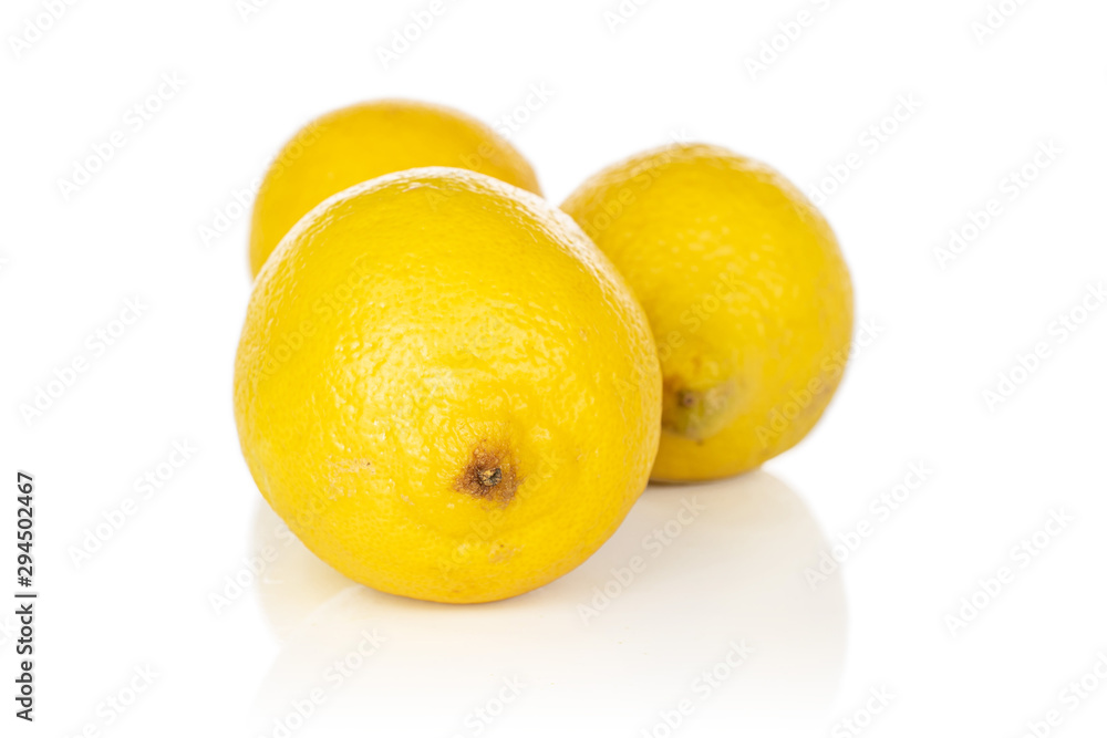 Group of three whole light fresh yellow lemon isolated on white background Group of three whole light fresh yellow lemon isolated on white background