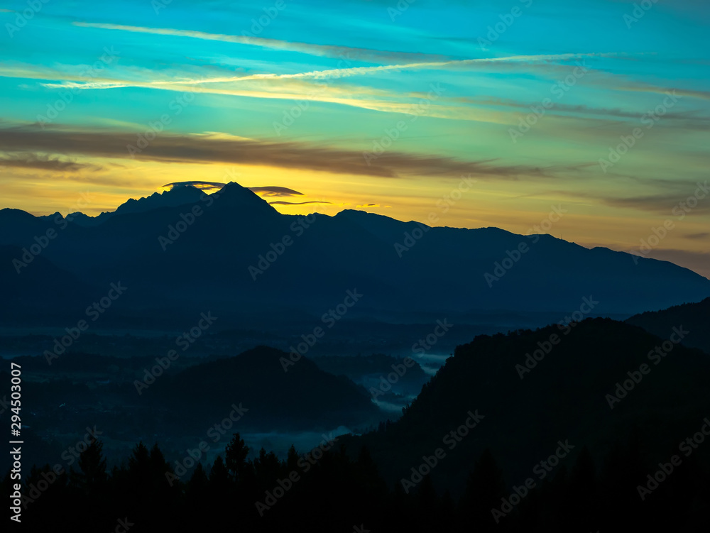View on the beautiful sunrise over the majestic hills with the Lake Bled in Slovenia
