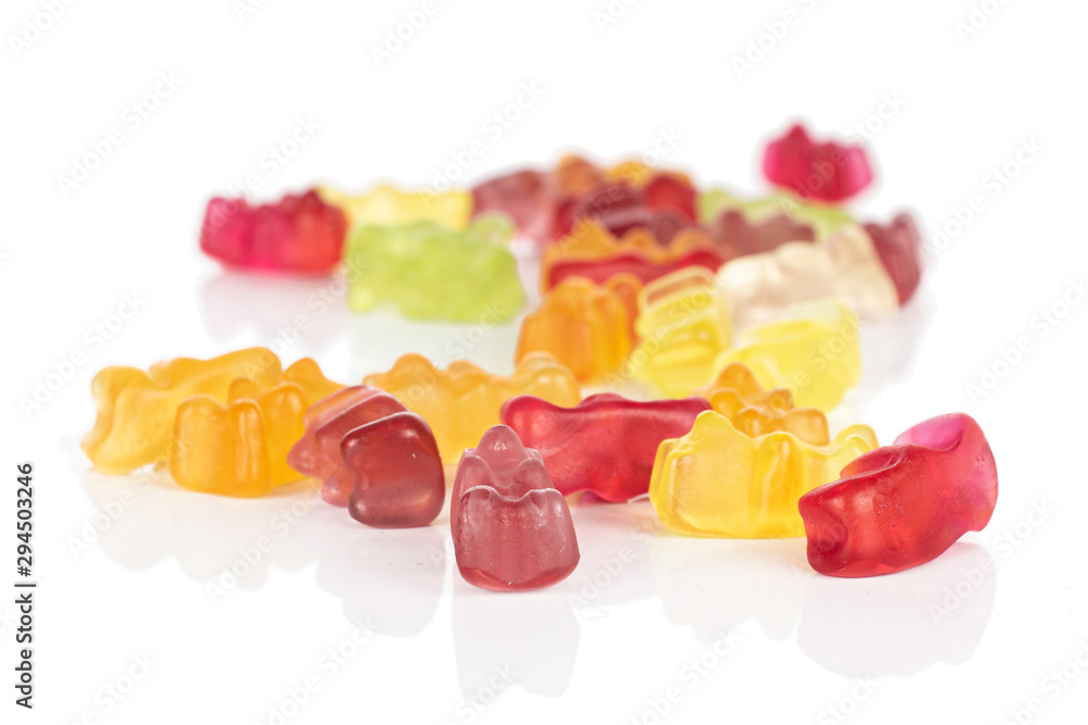 Lot of whole disordered gummy bear isolated on white background