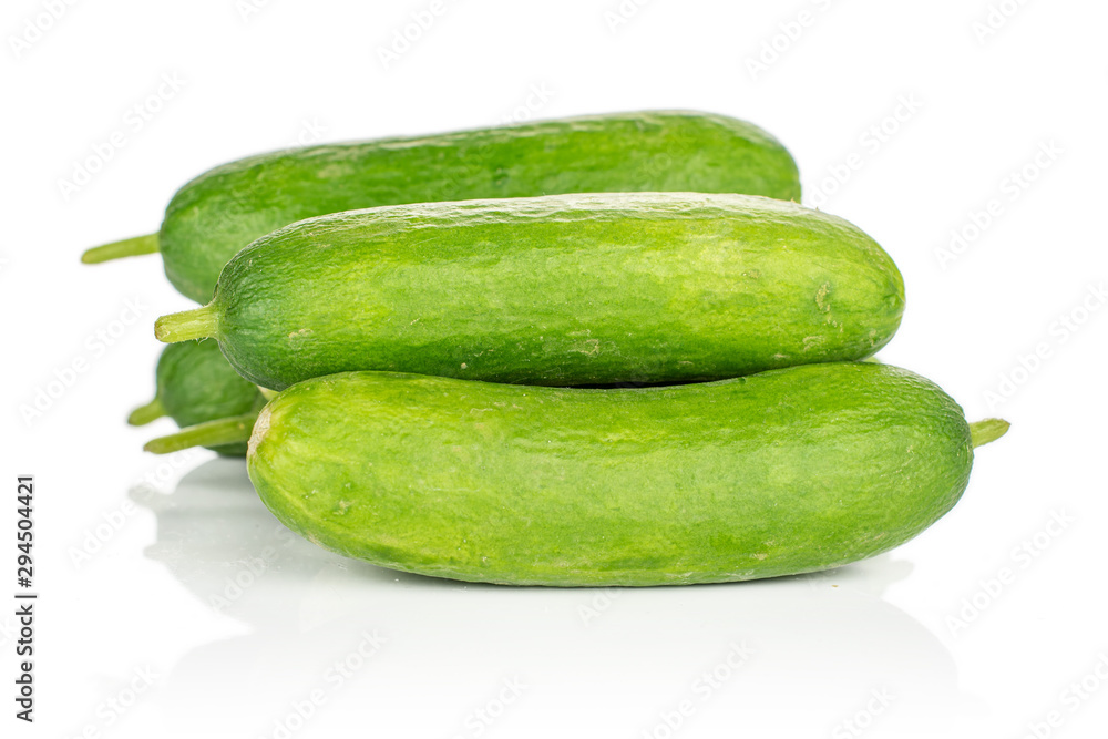 Lot of whole mini green cucumber isolated on white background Lot of whole mini green cucumber isolated on white background