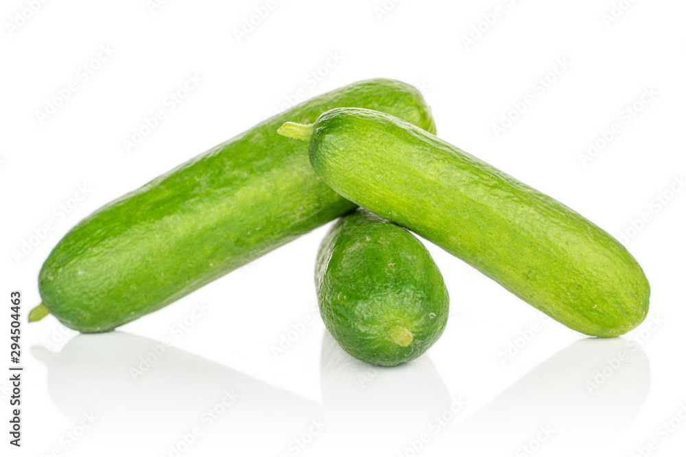 Group of three whole mini green cucumber isolated on white background Group of three whole mini green cucumber isolated on white background