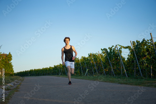 jogger Runner jogging  young attractive shorts vineyards sportsman sunset greenery nature sprint