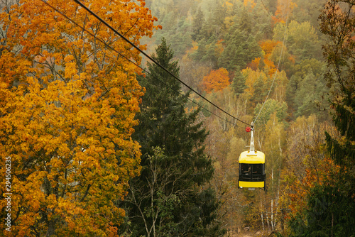 Cablecar Sigulda and Thick colourful forest in autumn season in Gauja National Park, Sigulda, Latvia.