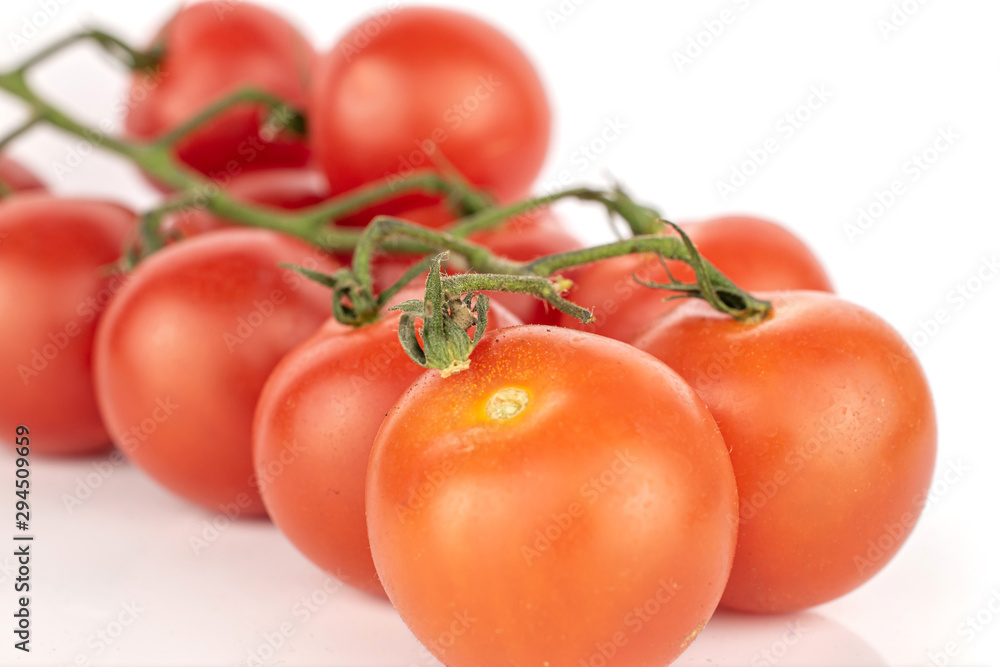 Lot of whole fresh red tomato cluster isolated on white background Lot of whole fresh red tomato cluster isolated on white background
