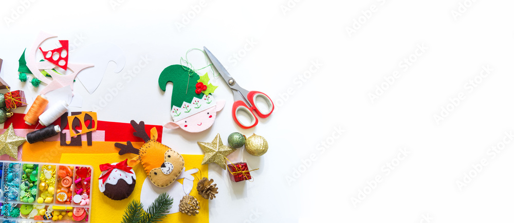 Obraz premium Craft soft toy decor for Christmas tree elf felt. Copy space Banner