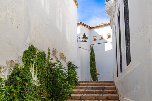 Cordoba streets on a sunny day in historic city center near Mezquita Cathedral