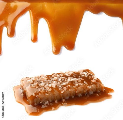 Stains of liquid caramel on white background