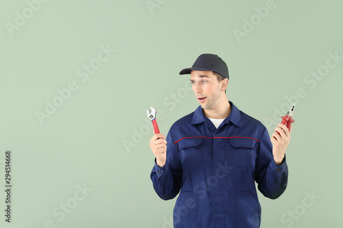 Male car mechanic choosing ...