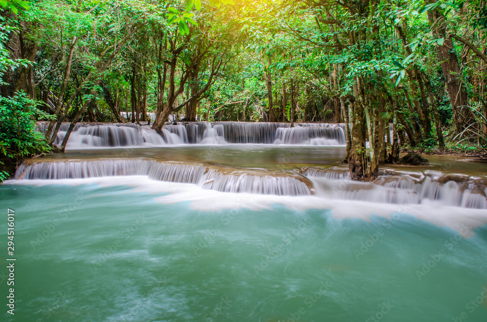 Travel to the beautiful waterfall in tropical rain forest, soft water of the stream in the Huai Mae Khamin Waterfall, Khuean Srinagarindra National Park, Kanchanaburi, Thailand 