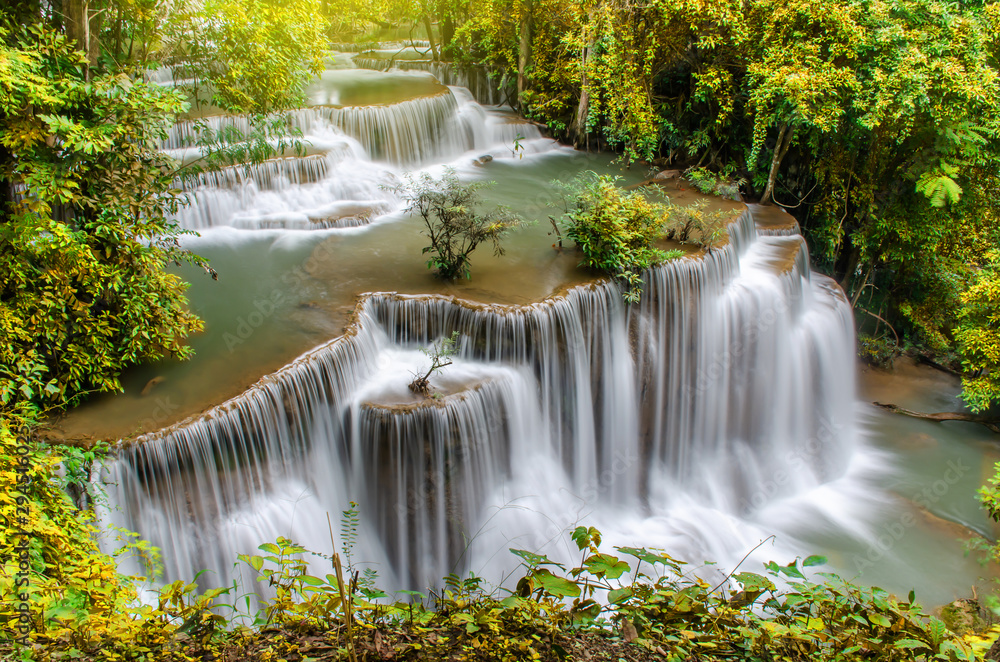 Travel to the beautiful waterfall in tropical rain forest, soft water of the stream in the Huai Mae Khamin Waterfall level 4, Khuean Srinagarindra National Park, Kanchanaburi, Thailand Travel to the beautiful waterfall in tropical rain forest, soft water of the stream in the Huai Mae Khamin Waterfall level 4, Khuean Srinagarindra National Park, Kanchanaburi, Thailand