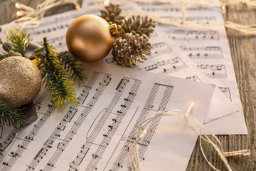 Christmas composition with music notes on table