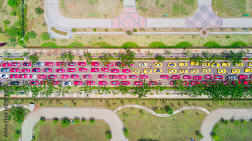 Картината върху платно Top view of Ferrari cars crowding on the road