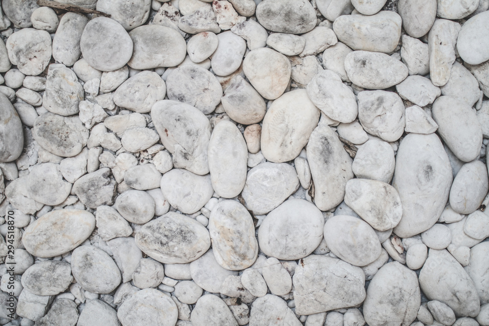 Small stones white and black construction industry material nature White pebbles placed on the floor Stone texture and background Small stones white and black construction industry material nature White pebbles placed on the floor Stone texture and background