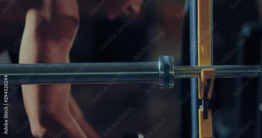Metal barbell barbell with pancakes, preparation for training. Close-up. Metal barbell barbell with pancakes, preparation for training. Close-up.