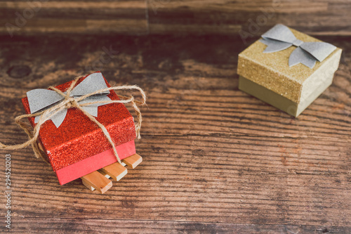 Christmas present box with bow and glitters photo