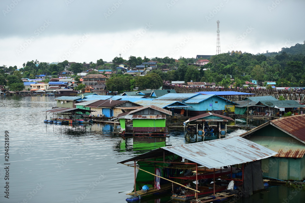 View of the river and surrounding communities of the dam near the Mon Bridge at Khao Laem Dam, Sangklaburi, Thailand.