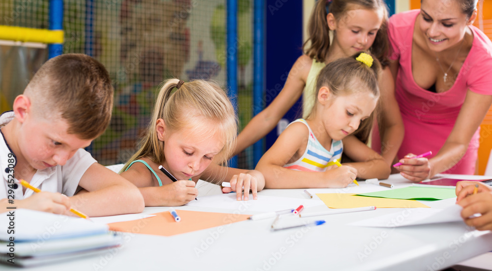 Fototapeta premium Children drawing on lesson in elementary school class