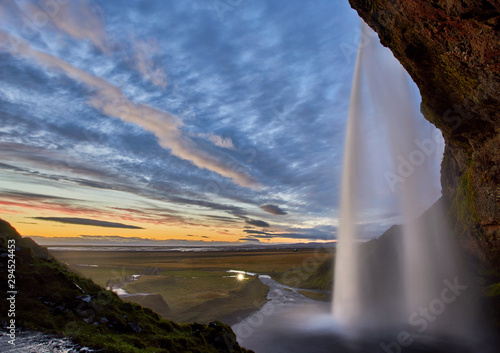 Stunning sunset at seljalandsfoss  iceland with flowing waterfalls