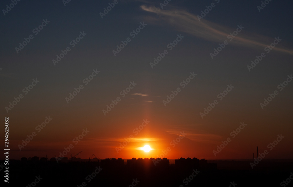 Scarlet sunset in autumn city 