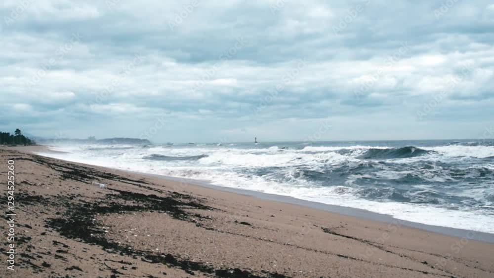 A seashore scene in which high waves come with cloudy weather and strong winds. South Korea Donghae the sea. A seashore scene in which high waves come with cloudy weather and strong winds. South Korea Donghae the sea.