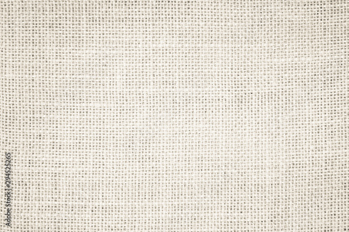 Cream Hemp rope texture background. Haircloth or blanket wale linen wallpaper. Rustic sackcloth canvas fabric texture in natural. Natural vintage linen burlap weaving, Old beige carpet background.