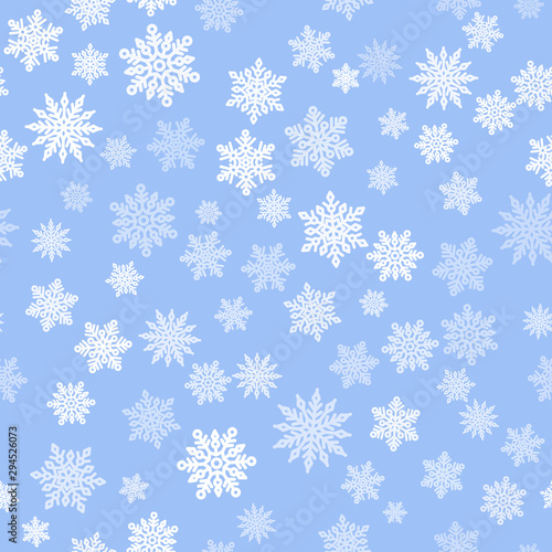 Vintage snowflakes seamless pattern layout. Small white snowflakes on light blue background. Template for christmas gifts wrapping paper. Winter season wallpaper vector illustration.