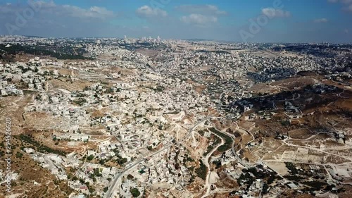 The old city of Jerusalem Aerial flight view Daylight Drone view over East Jerusalem arab neighborhoods photo