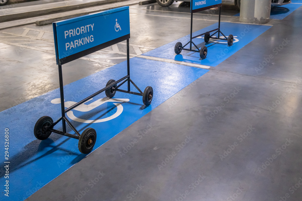 Blue label priority parking sign for car parking in shopping mall. Blue label priority parking sign for car parking in shopping mall.